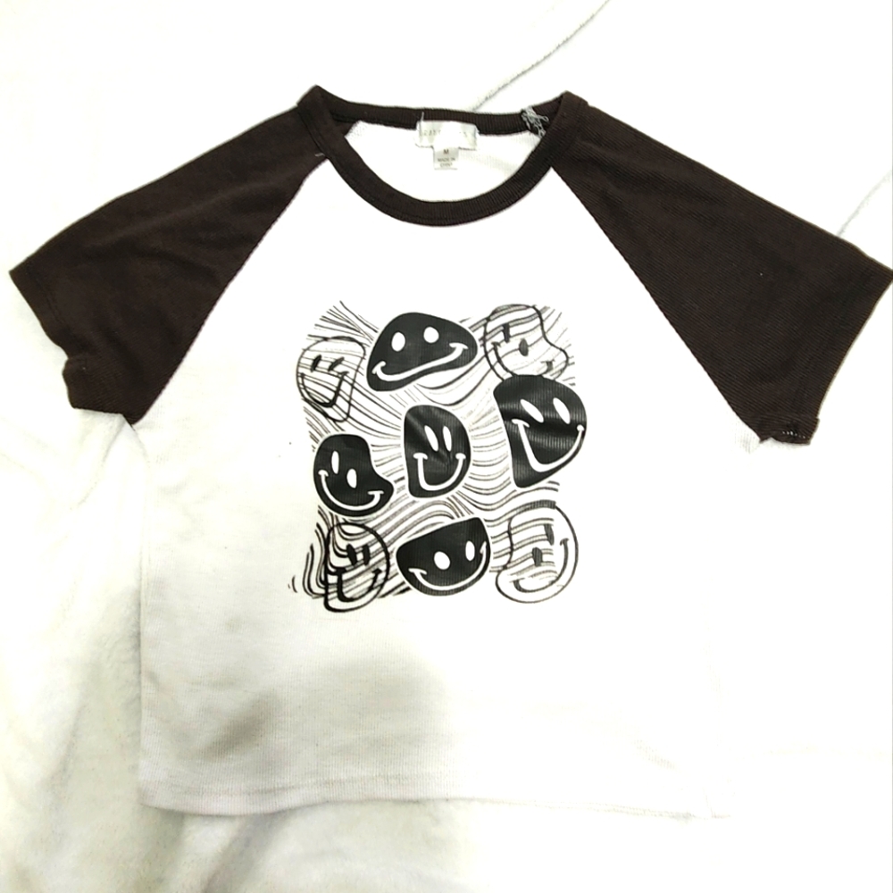 black and white blouse with smiley faces
